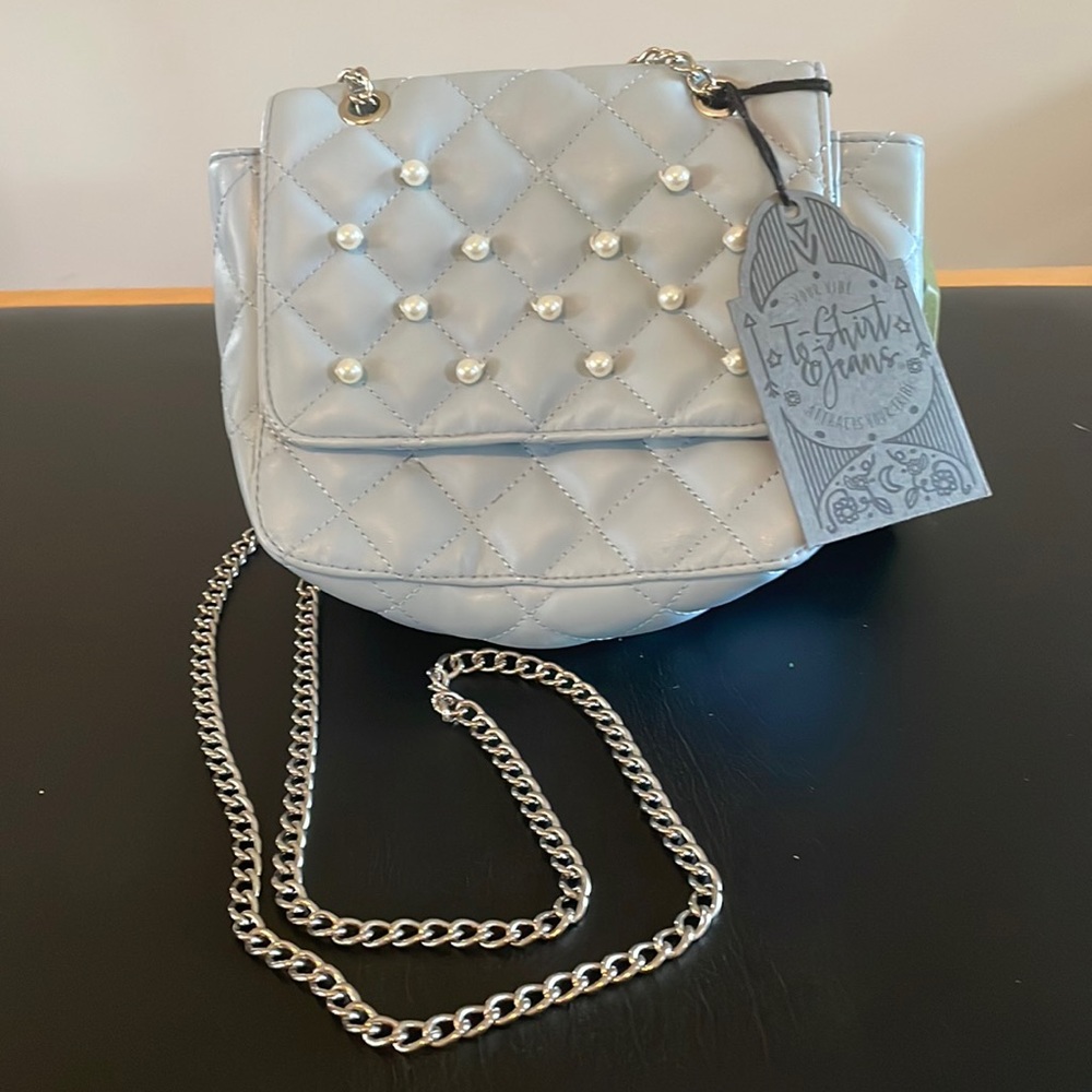 Cute powder blue purse with Pearl accents. NEW with original tag.